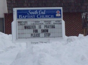 Whoever is praying for snow please stop Sign outside snowbound church - Whoever is praying for snow please stop